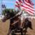 Jenna carries the flag on the 4th of July